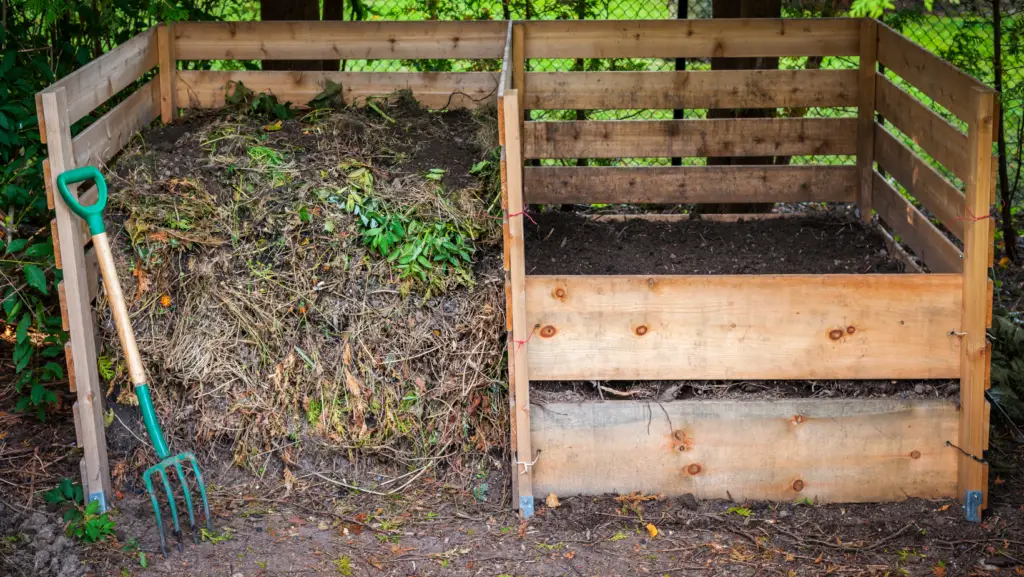 compost pile in a wooden compost container